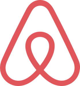 Airbnb logo consisting of a stylized, abstract A shape in coral color.
